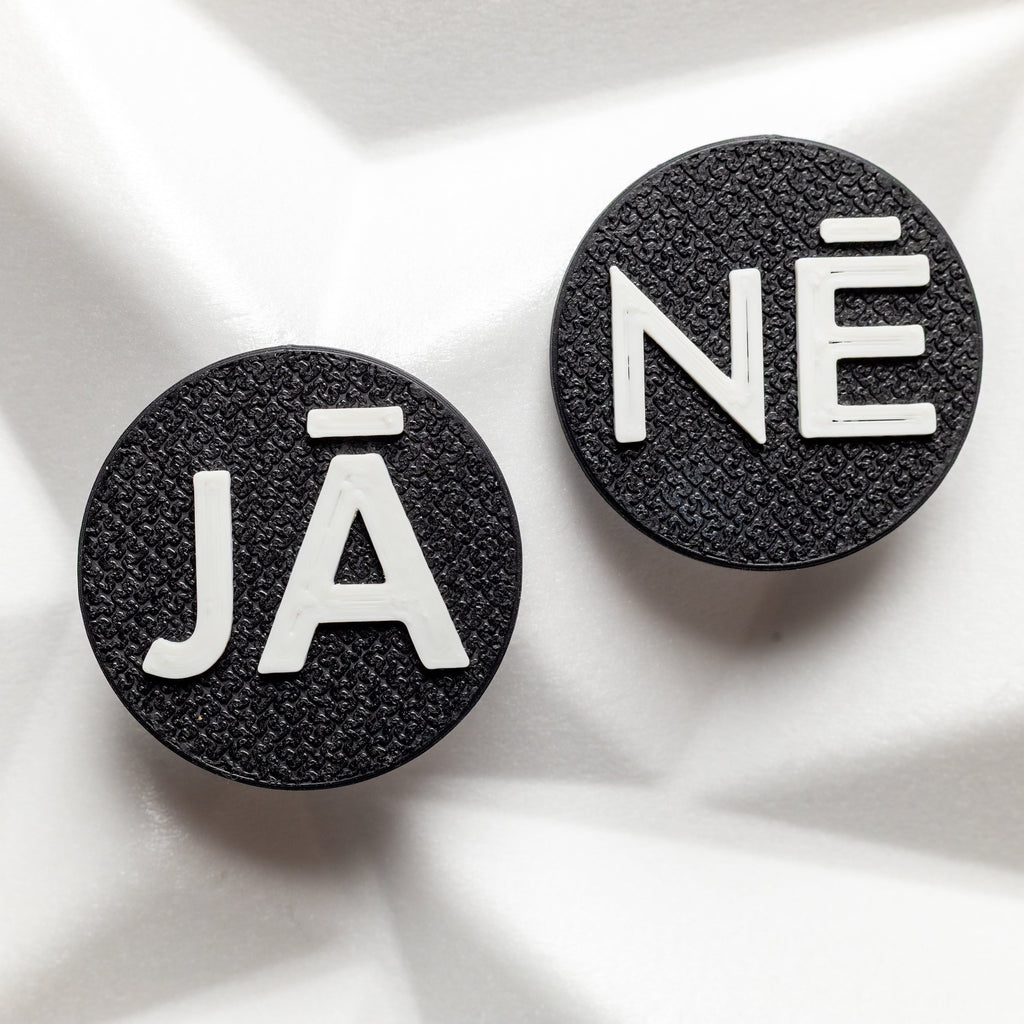 Side view of the NEONOVA clip-on fitting, shown on an existing clip-on earring