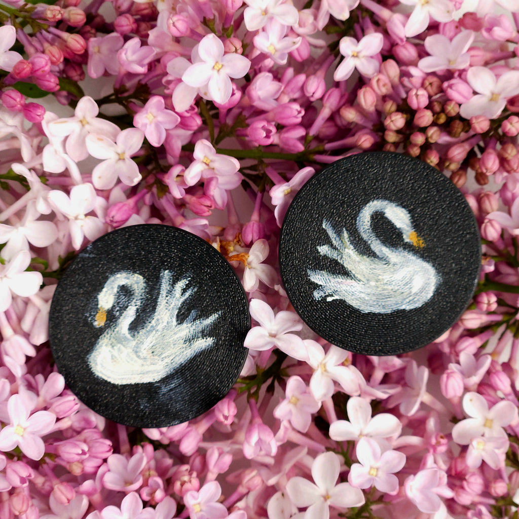 Black lightweight earrings with white swan design handpainted 