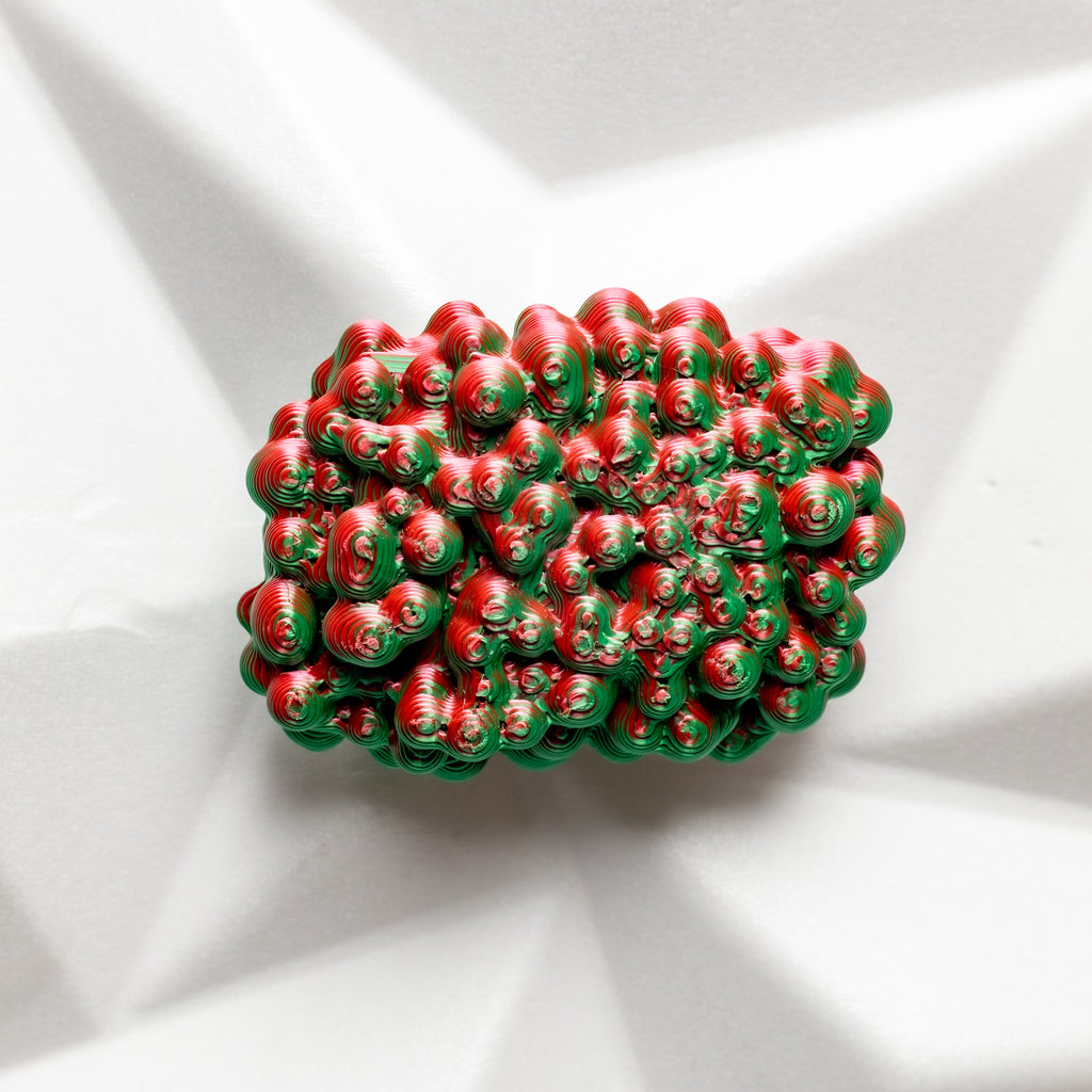 Red and green textured bunch of berries on a white background