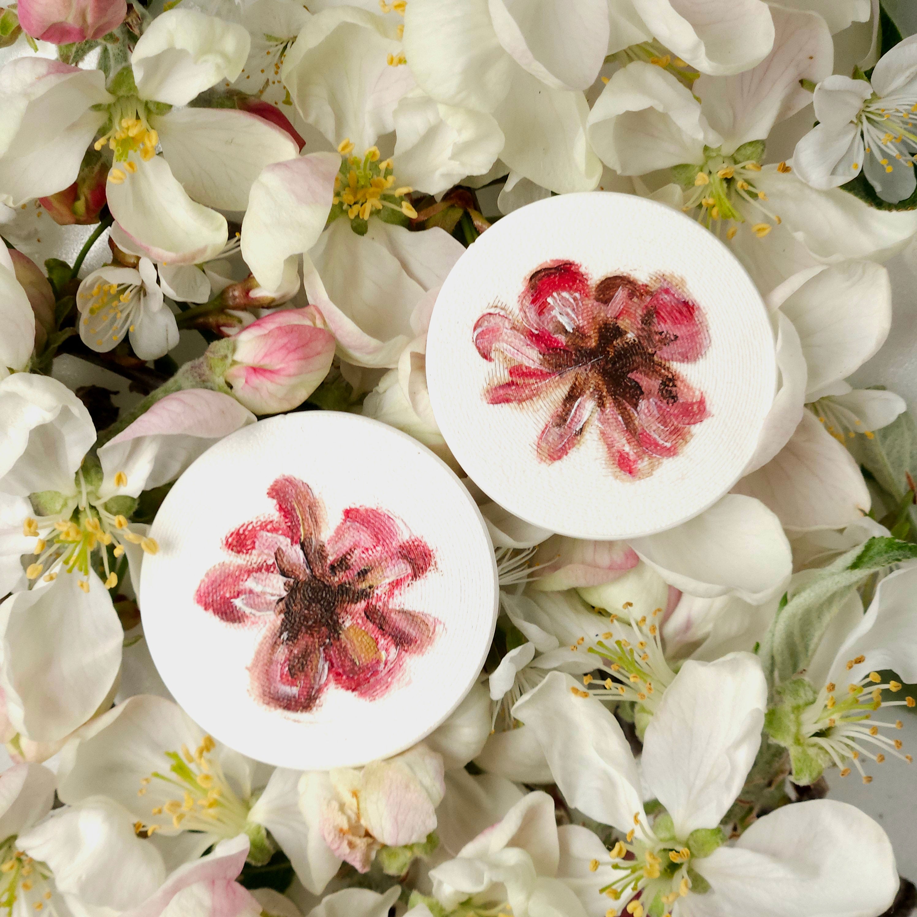 Two white lightweight earrings with oil painted colorful nature elements - flowers, bugs, butterflies. 