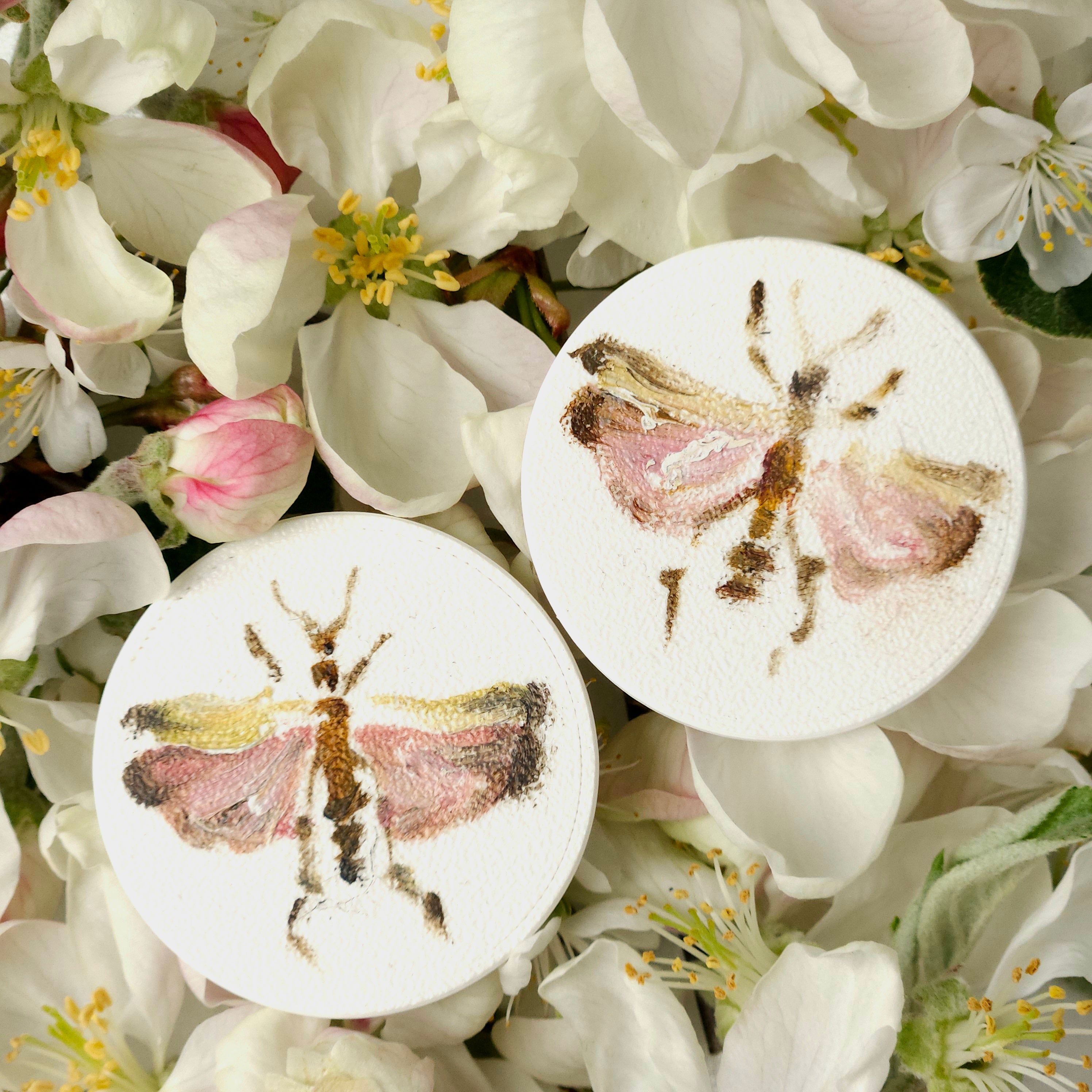 Two white lightweight earrings with oil painted colorful nature elements - flowers, bugs, butterflies. 