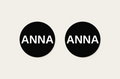 Pair of 42mm black custom text earrings reading ANNA in white Classic lettering