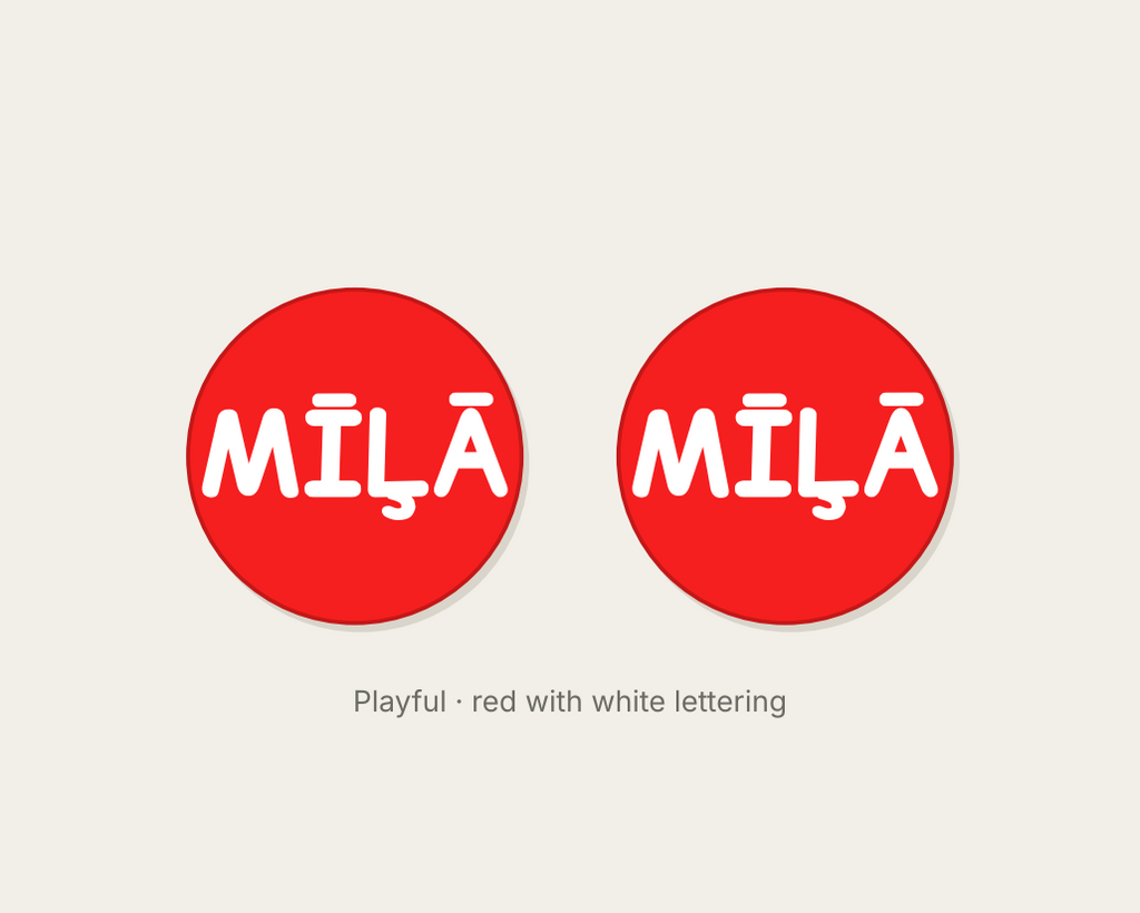 Pair of 42mm red custom text earrings reading MILA in white Playful lettering