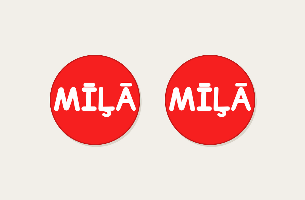 Pair of 42mm red custom text earrings reading MILA in white Playful lettering