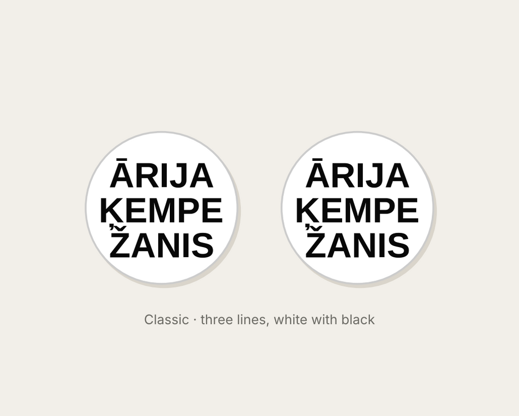 Pair of 42mm white custom text earrings with three lines of black Classic lettering