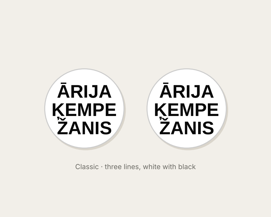 Pair of 42mm white custom text earrings with three lines of black Classic lettering