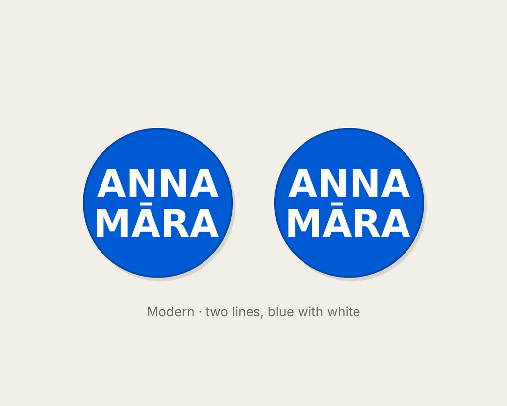 Pair of 42mm blue custom text earrings with two lines of white Modern lettering